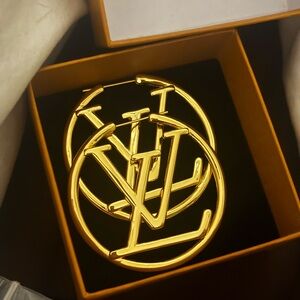 Gold Louis Vuitton hoop earrings